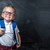 Junge mit Brille vor einer Schultafel Junge mit Brille vor einer Schultafel
