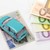 Türkises Miniaturauto Führerschein und Euroscheine Türkises Miniaturauto Führerschein und Euroscheine