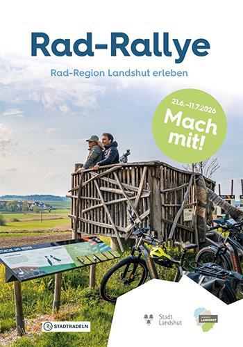 Zwei Personen auf einem Aussichtsturm mit Rädern im Vordergrund